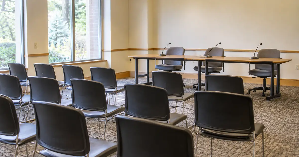 AI-generated illustration: an empty public meeting room
