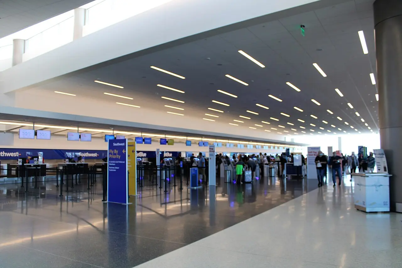 The check-in hall at Salt Lake City International Airport, with ticket counters and travelers
