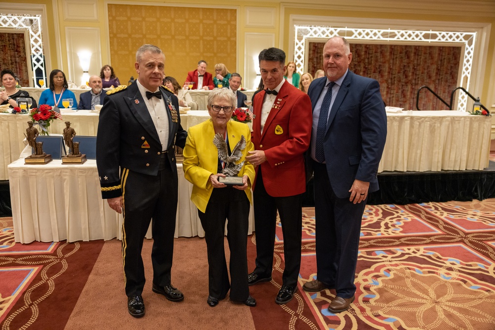 Brian Garrett, far right, joins Karen Mayne, Michael Turley and Jeff Burton during the 2023 Bronze Minuteman Awards.
